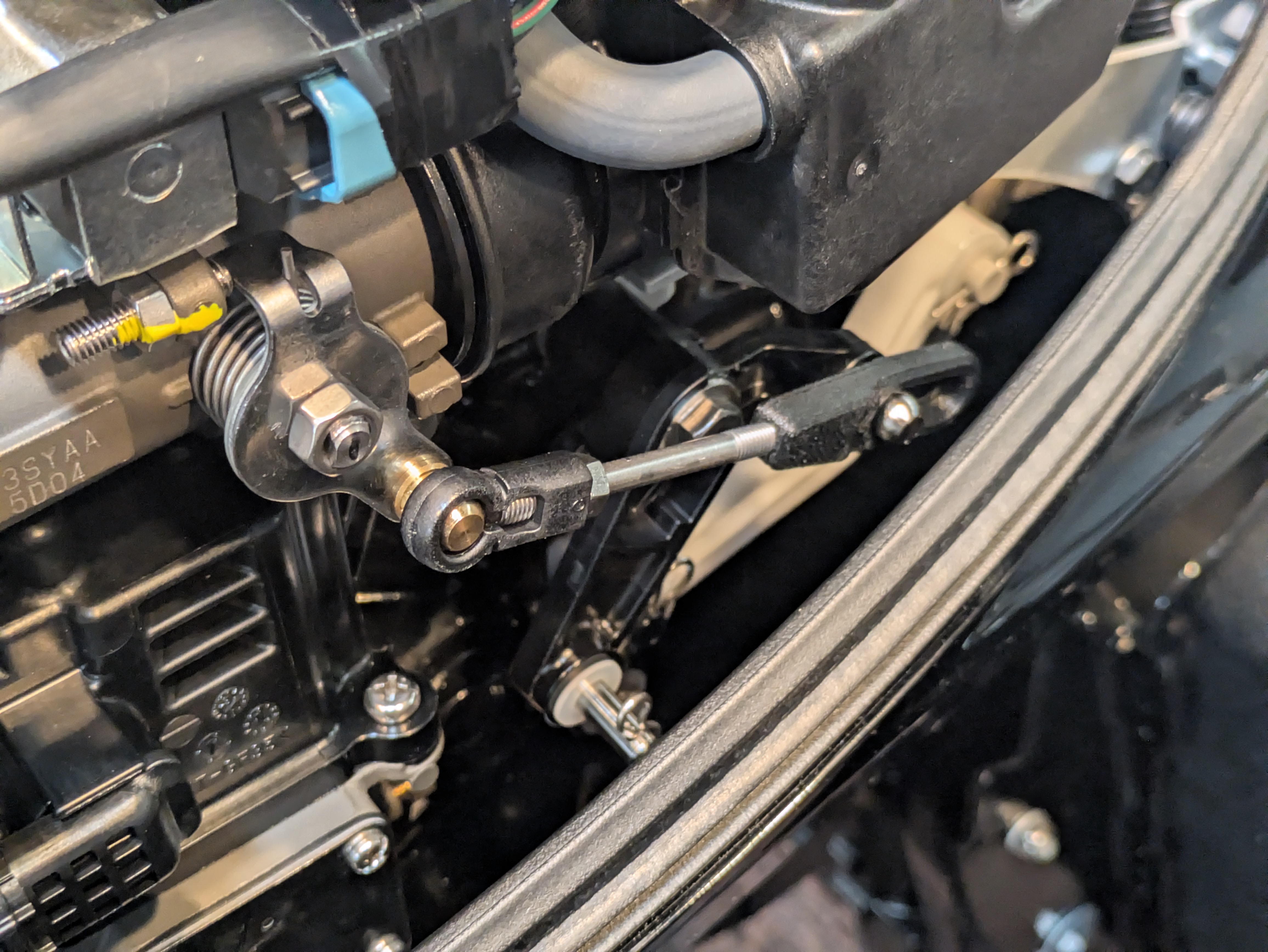 Modified pushrod reinstalled on the Mercury throttle linkage