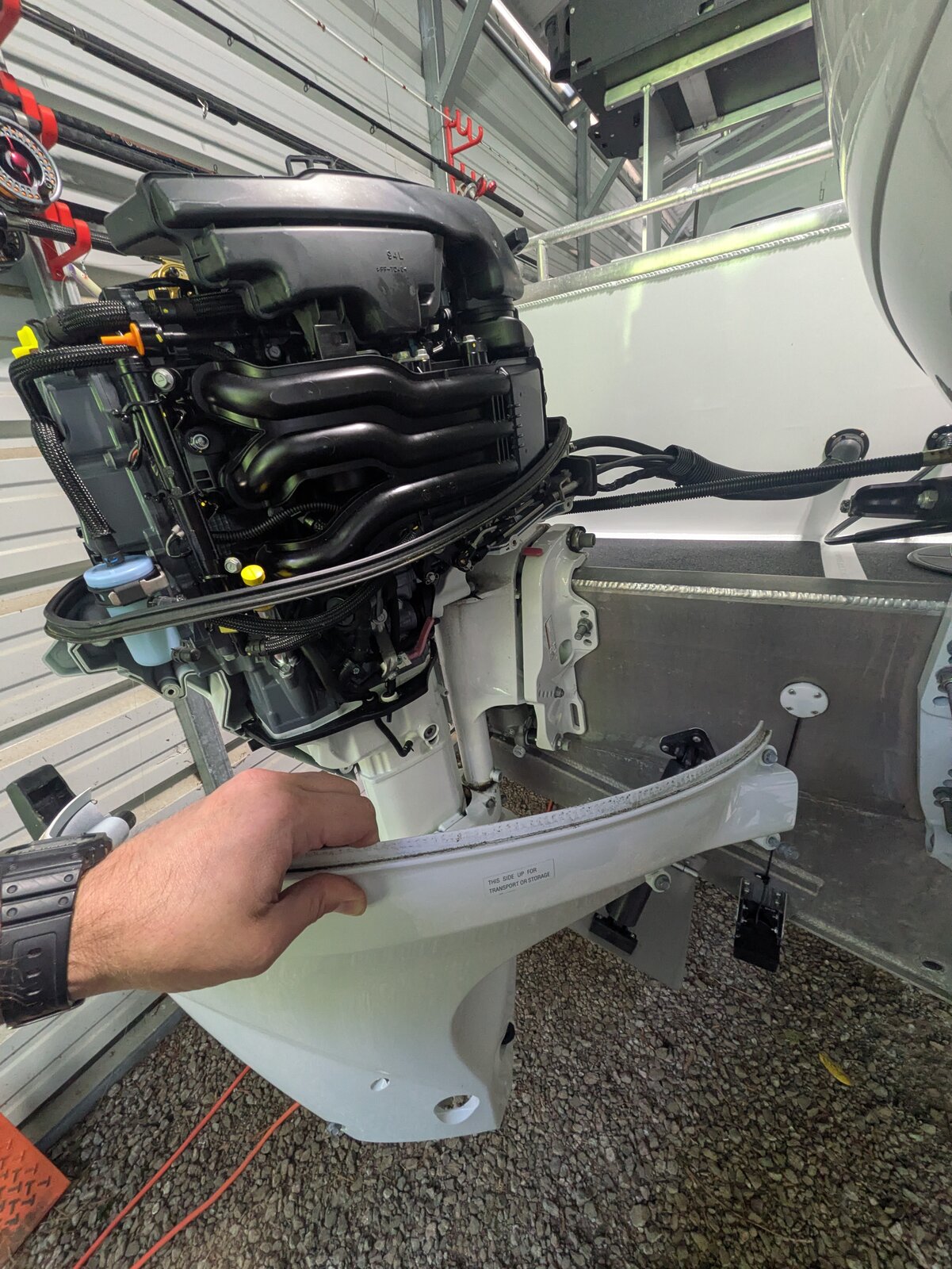 Removing the cowling and starboard side panel on the Suzuki motor