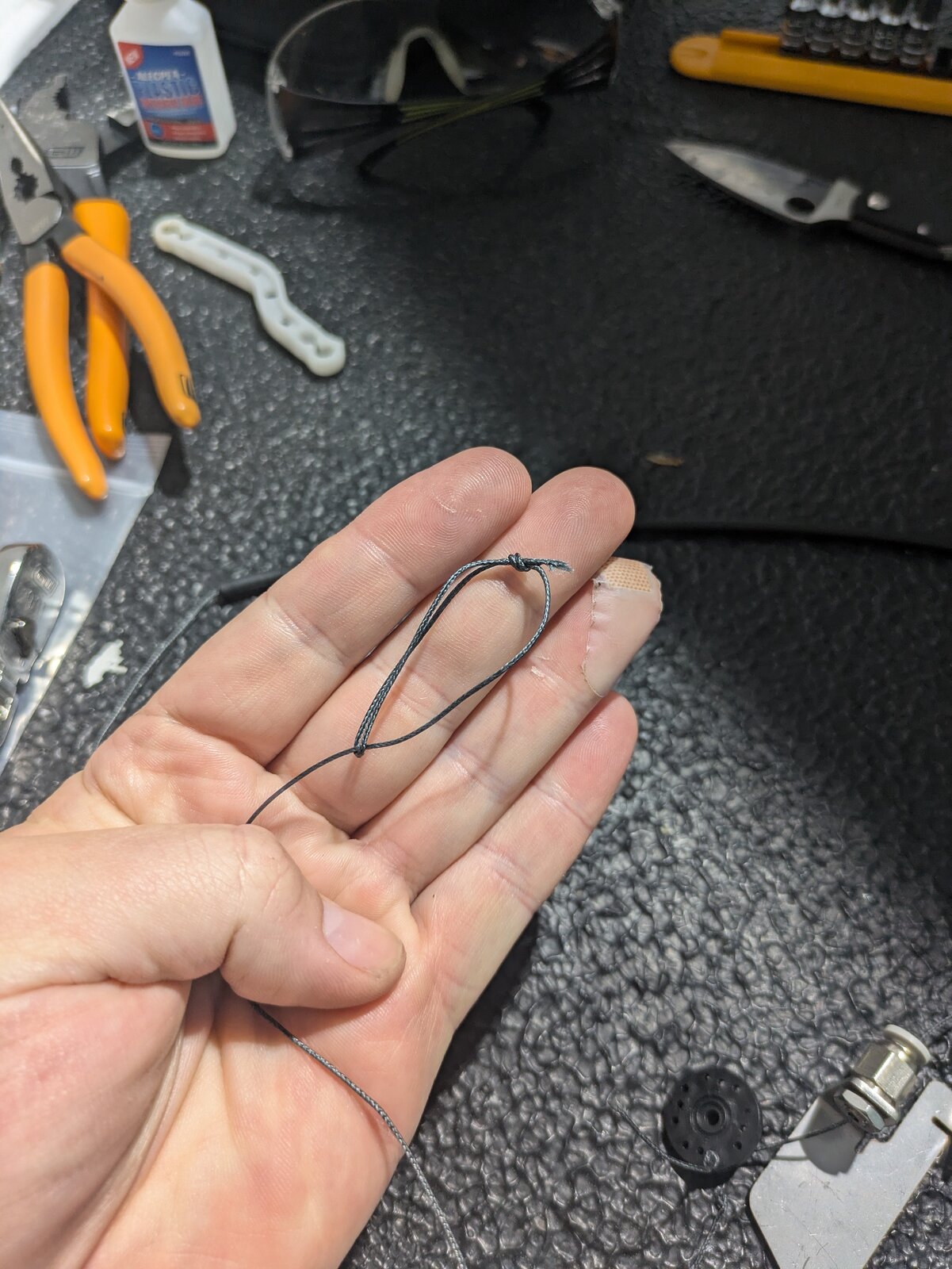 Tying a loop knot in the end of the braided cable