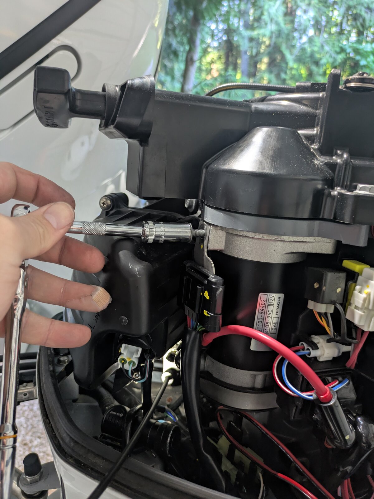 Removing the bolt for the servo bracket mounting point