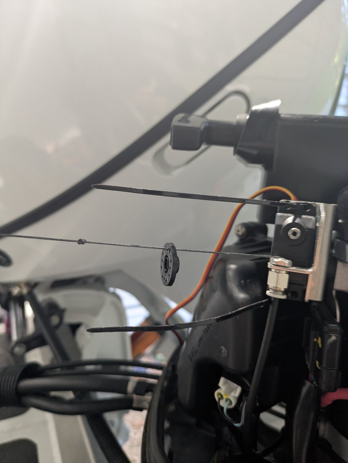 Routing the braided cable through the servo horn and tying the knot