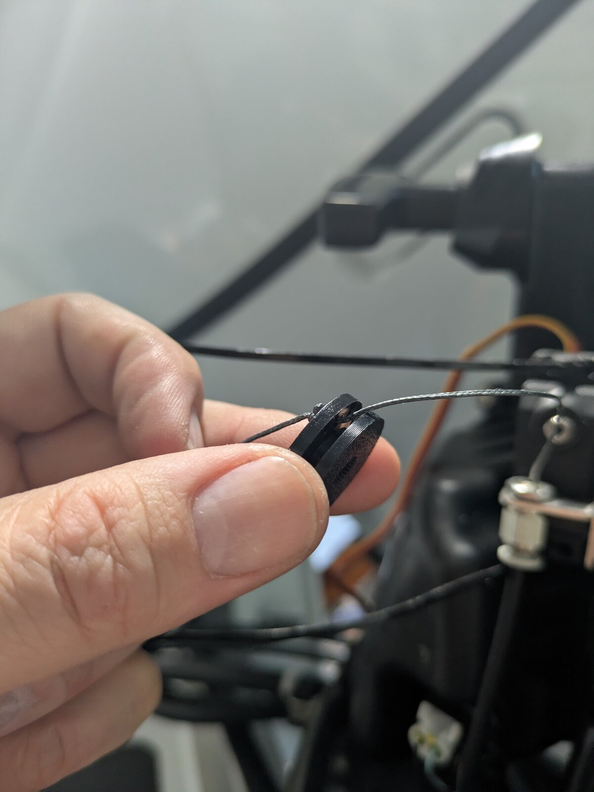 Installing the servo spool adapter with the braided cable coiled