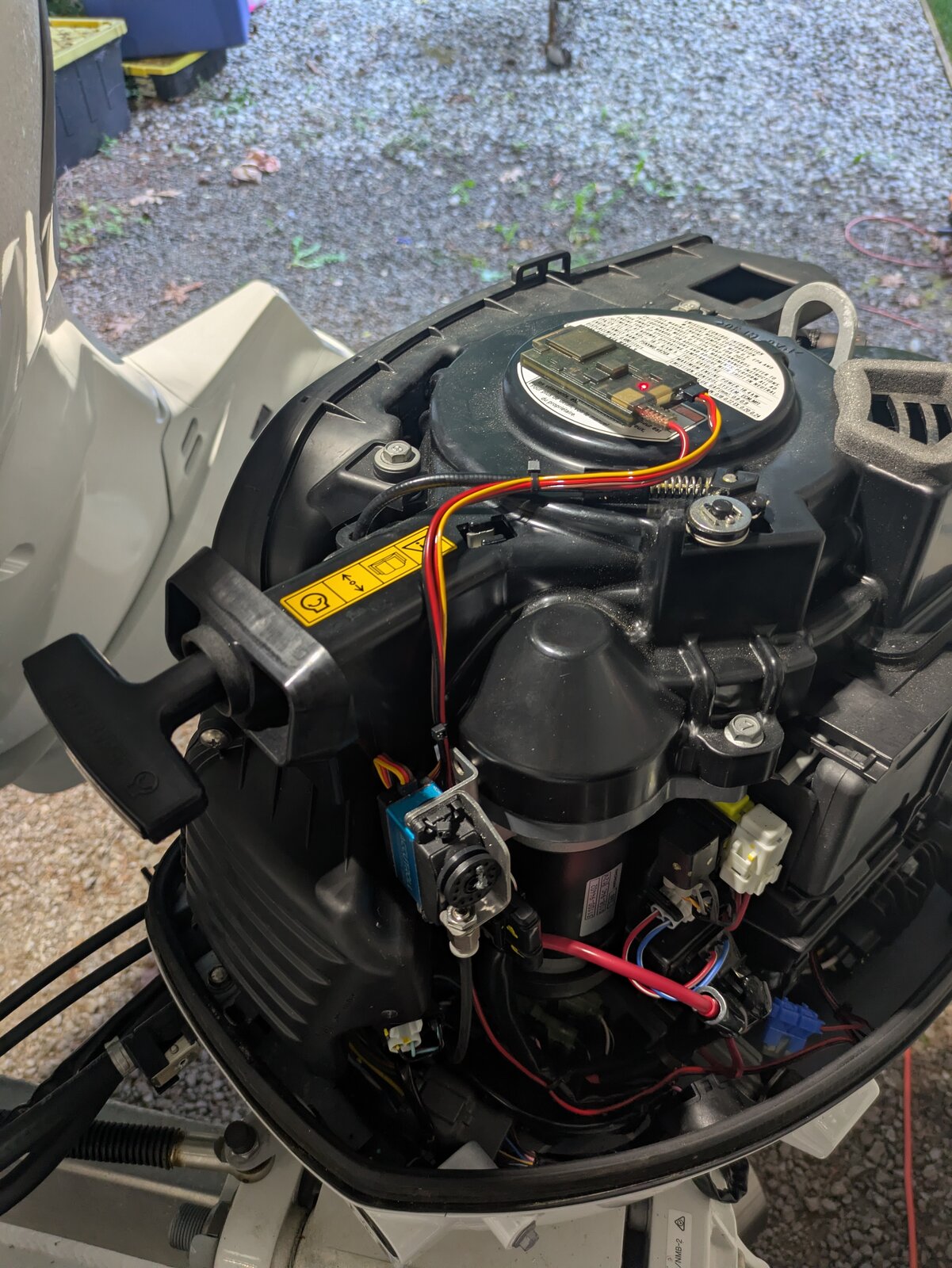 Final view of the completed Accutroll installation on the Suzuki motor